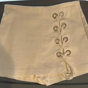 Cream colored lace up skorts